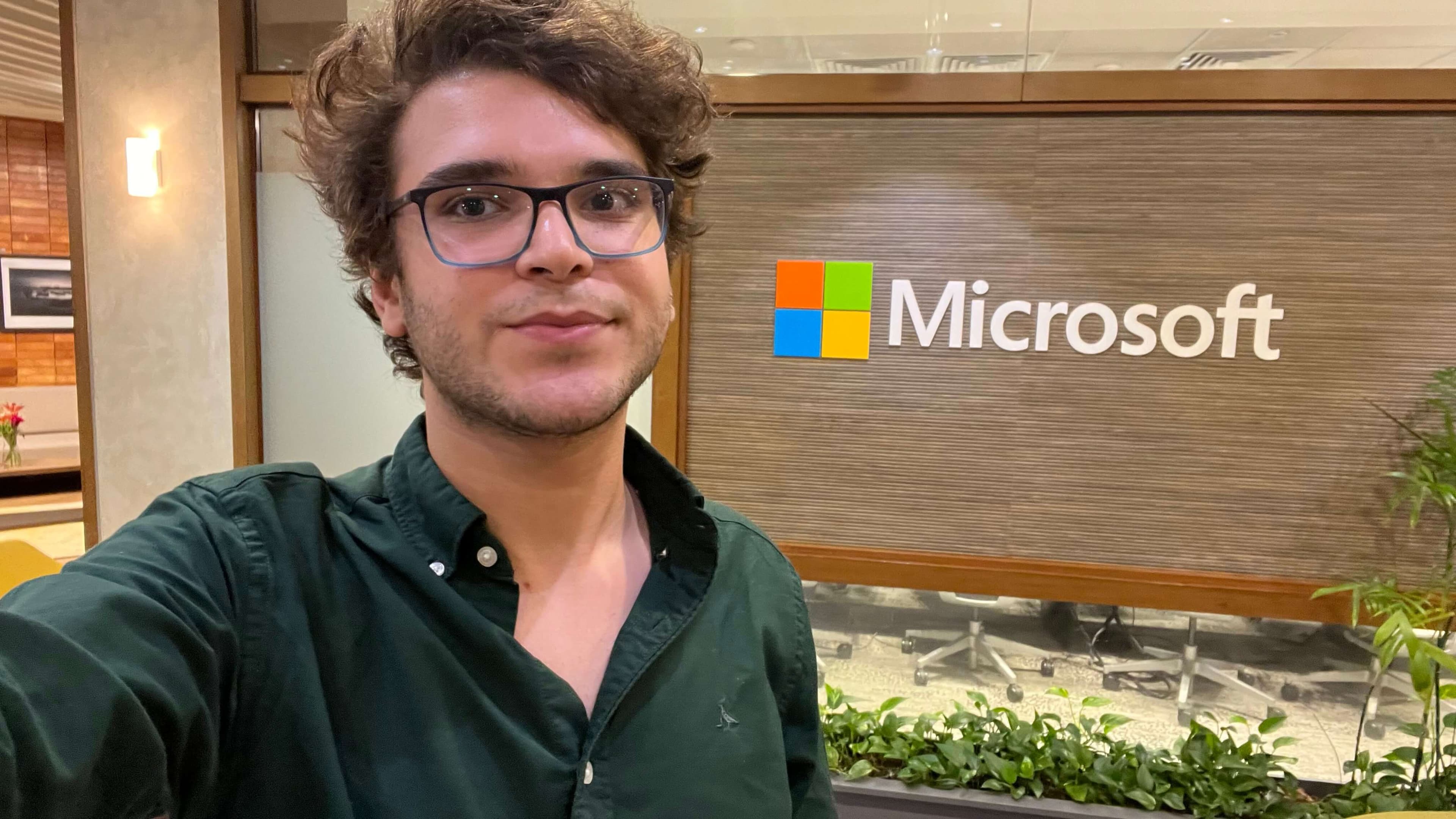 Baraa standing in front of Microsoft Logo in Zamalek, Egypt office